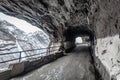 Old tunnel hiking road winter snow with icicles Royalty Free Stock Photo