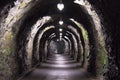 Old tunnel sparsely lit in the Swiss Alps