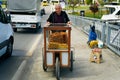 Old Turkish man selling traditional turkish bread in the street, street vendor smiling in Istanbul, 20 April 2023