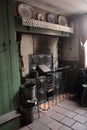 Old victorian kitchen scene with old cast iron range