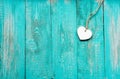 Old turquoise wooden floor with a white wooden heart Royalty Free Stock Photo