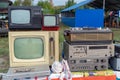 Old TV, cassette recorder and other retro radio equipment on the table Royalty Free Stock Photo