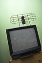 Old TV set, noisy picture, aerial.