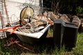 Old TV set and the rest of bulky trash. Old TV thrown away next to a wall with a pile of mixed garbage. Royalty Free Stock Photo