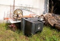 Old TV set and the rest of bulky trash. Old TV thrown away next to a wall with a pile of mixed garbage.