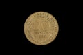 An old French franc coin isolated on a black background Royalty Free Stock Photo