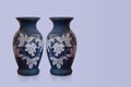 Old two blue and white ceramic vases on viole background, object, retro, vintage, decor, copy space