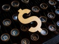 An old typewriter and a dollar sign as symbol of content monetization.