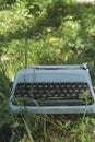 Old typewriter on the grass Royalty Free Stock Photo