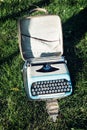 Old typewriter on the grass Royalty Free Stock Photo