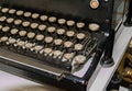 Old typewriter keyboard close up with circular keys with alphabet letters Royalty Free Stock Photo