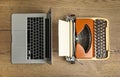 Old typewriter and laptop on wooden table, flat lay. Concept of technology progress Royalty Free Stock Photo