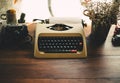 Old typewriter on old wooden table Royalty Free Stock Photo