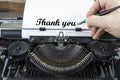 Old typewriter from seventies with paper and copy space. With writing hand and thank you note Royalty Free Stock Photo