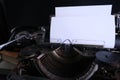 Old typewriter on table, blank white sheet for text, mockup, retro style, concept of works of a writer, journalist Royalty Free Stock Photo