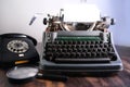 Old typewriter on table, blank white sheet for text, mockup, retro style, concept of works of a writer, journalist Royalty Free Stock Photo