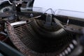 Old typewriter on table, blank white sheet for text, mockup, retro style, concept of works of a writer, journalist Royalty Free Stock Photo