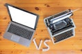 Old typewriter vs new laptop on the table. Concept of technology progress. Royalty Free Stock Photo