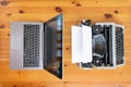 Old typewriter vs new laptop on the table. Concept of technology progress. Royalty Free Stock Photo