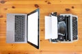 Old typewriter vs new laptop on the table. Concept of technology progress. Royalty Free Stock Photo