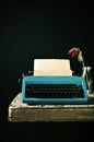 Old typewriter and a wilted red rose Royalty Free Stock Photo