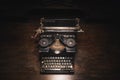 Old typewriter on a wooden table Royalty Free Stock Photo