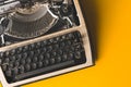 Old Typewriter On A Yellow Background, Top View. Creative Journalism Concept Royalty Free Stock Photo