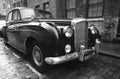 Old typical brick house in Shoreditch London with Bentley vintage car