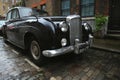 Old typical brick house in Shoreditch London with Bentley vintage car