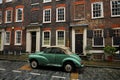 Old typical brick house in Shoreditch London with green vintage car Royalty Free Stock Photo