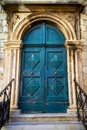 Old typical green painted wood door Royalty Free Stock Photo