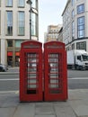 old typical london phone booths with symmetry