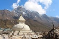 Old typical white Buddhist stupa at the foot of mountain in Nepal Royalty Free Stock Photo