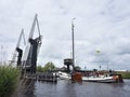 Old typical wooden sailing vessel on lake near Sneek in dutch pr