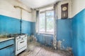 Old ugly abandoned empty kitchen in a residential building Royalty Free Stock Photo