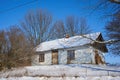 Old Ukrainian house in winter,on a hill made of clay, the house is abandoned in the snow, no one lives in the house Royalty Free Stock Photo