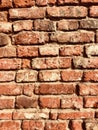 Old uneven red brick wall
