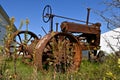 Old rusty tractor parked in the weed