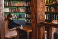 Old university college library interior with a bookshelves, books and bookcase, classic style school interior archive with wooden