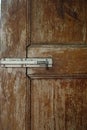 An old unsafe small lock on a door