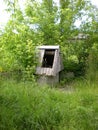 Old, unused and broken wooden well