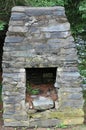 An old unused outside fire stove in Nova Scotia Canada. Royalty Free Stock Photo