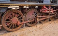 Old unused steam locomotive train at Wadi Rum railroad station, closeup detail to rusty wheels Royalty Free Stock Photo