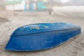 Old Upturned Boat Blue Lies on the Shore of the Dried Lake . Royalty Free Stock Photo