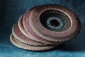 Old used abrasive flap discs on metalic background