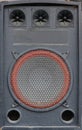 Old used audio speaker texture on dark blue