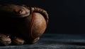 Old used baseball in ball glove