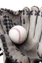 Old used baseball glove and ball isolated closeup Royalty Free Stock Photo