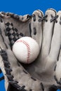 Old used baseball glove and ball isolated closeup Royalty Free Stock Photo