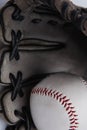 Old used baseball glove and ball isolated closeup Royalty Free Stock Photo